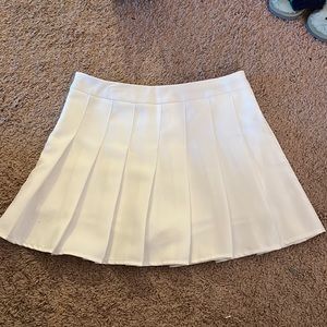 white pleated tennis skort